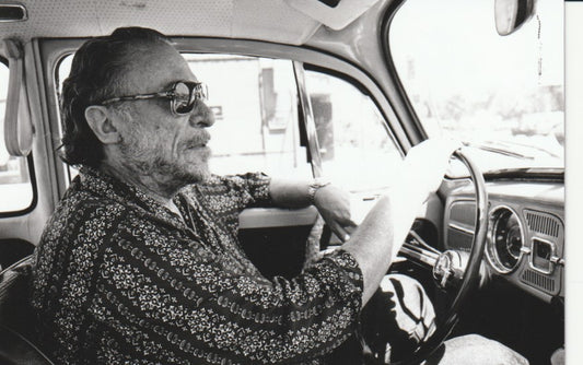 Bukowski Driving His Volks. Signed by Michael Montford (1976)